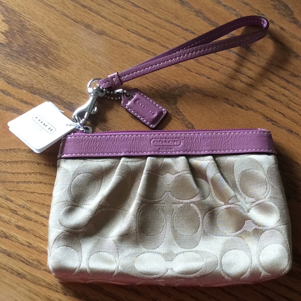 NWT, Coach, Signature Wristlet. Khaki/rose